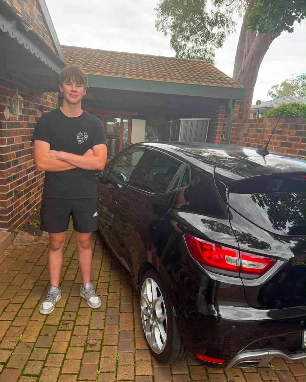 Jack, founder of JDK Detailing, beside a freshly detailed car
